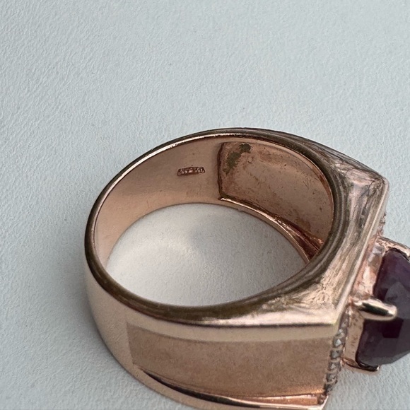 925 Rose Gold ring with an oval ruby cabochon and sapphire accents.